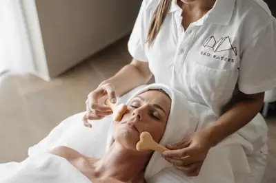 a woman in a spa receiving a massage from a womanorative practition at Bad Ratzes in Siusi