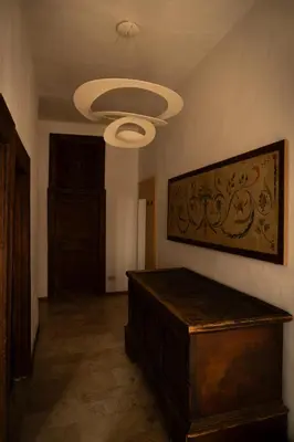 a room with a bed and a ceiling at Residence Fink Central Apartments in Bolzano