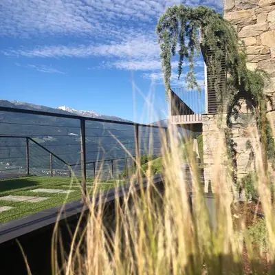a view of a bridge with grass in the foreground at Chalet in Naturno