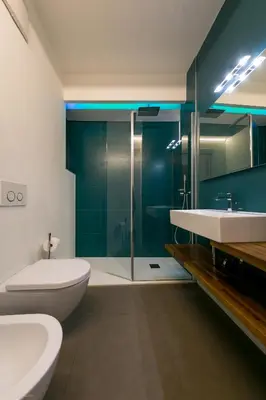 a bathroom with a toilet and a sink and a shower at Apartment Vanga in Bolzano