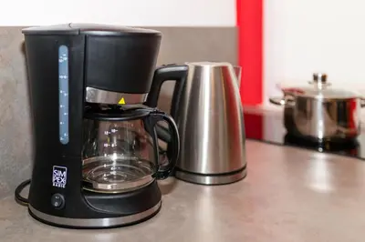 a coffee maker sitting on a kitchen counter at Apartment Vanga in Bolzano