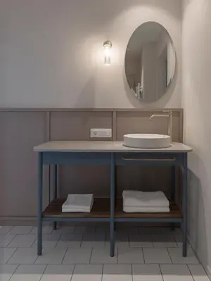 a bathroom with a sink and a mirror at Villa Helvetia in Merano