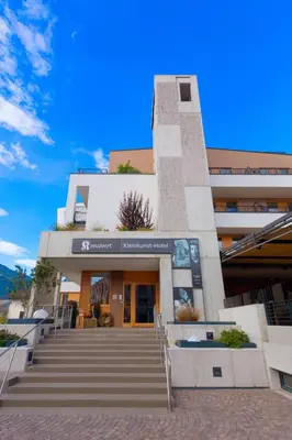 a building with stairs in front of it at Kleinkunsthotel in Naturno