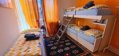a bedroom with two bunk beds and a window at Casa Mia in Vadena