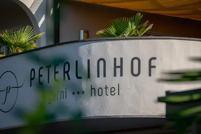 a sign for a pterilota hospital at Garni Hotel Peterlinhof in Caldaro