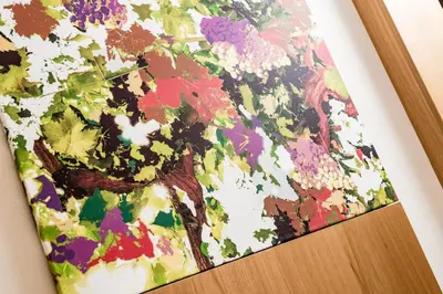 a close up of a painting on a book at Hotel Hasslhof in Caldaro