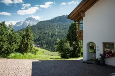 a building with a view of a mountain at Apartments Tino in La Valle