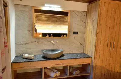 a bathroom with a bowl sink on a counter at Haus Cosso in Villabassa