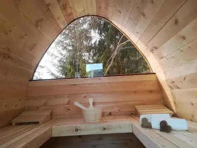 an inside view of a wooden sauna with a window at Kaserhof wandern- Alleinlage - ruhig- top Aussicht in Bressanone