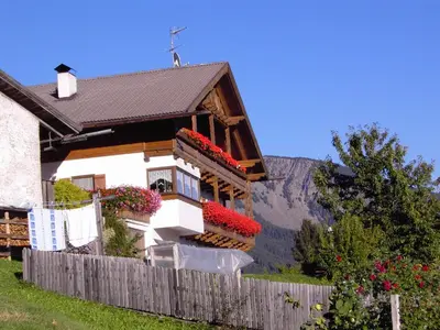 a house with a cross on top of it at Gspoi-Hof in Laion
