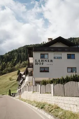 a building on the side of a road at Hotel Lahnerhof in Vipiteno