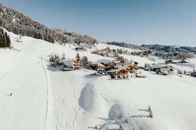 a ski lodge on a snow covered mountain at Refugium LaFlu Apartments in Corvara in Badia