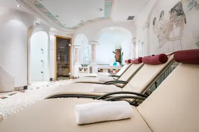 a row of empty beds in a room at Residence Floralp in Colfosco
