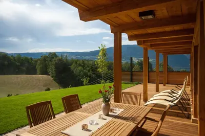 a dining room with a table and a window at Dosserhof in Fiè