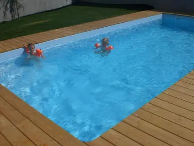 two children are in a swimming pool at Biobauernhof St. Quirinus in Caldaro