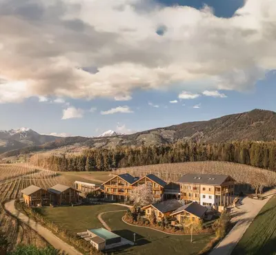 an aerial view of a resort with mountains in the background at Kessler's Mountain Lodge in Naz-Sciaves