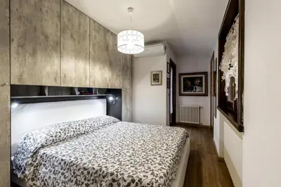 a bedroom with a large bed in a room at Des Alpes 2 in Canazei