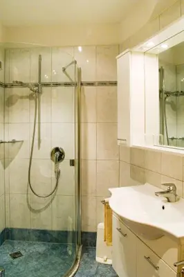 a bathroom with a shower and a sink at Plonerhof in Lagundo
