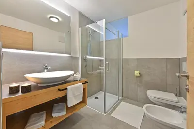 a bathroom with a sink and a shower at Forchnerhof Panorama - App 3 Täler Blick in Rodengo