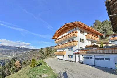 a house on a hill with a road at Forchnerhof Panorama - App 3 Täler Blick in Rodengo