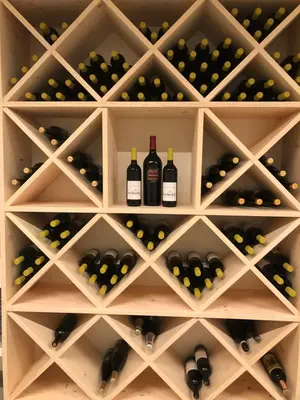 a wine cellar with wine bottles and grapes at Forchnerhof Panorama - App 3 Täler Blick in Rodengo