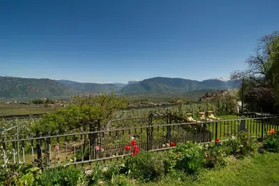 a garden with a view of the mountains at Haus St. Valentin in Appiano sulla Strada del Vino