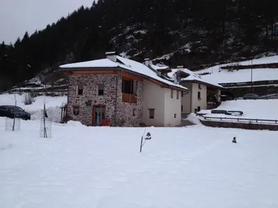 a building in the snow in front at Maso Toneto in Castello di Fiemme