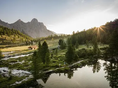 a view of a river with mountains in the background at Hotel Elisabeth in Chienes