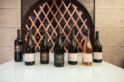 a group of wine bottles sitting on a counter at Hotel Weingut Stroblhof in Appiano sulla Strada del Vino