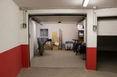 a hallway in a gym with a door open at Casa Zone in Tesero