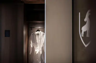 a shirt is hanging on a hanger in a closet at Hotel Ansitz Steinbock in Villandro