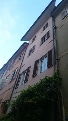 a tall building with windows on the side of it at Ugo Art Lodge Classic in Bolzano
