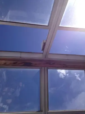 three windows in a room with the sky at Ugo Art Lodge Bright in Bolzano