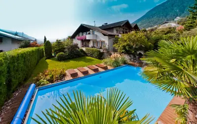 an aerial view of a house with a swimming pool at Guesthouse Christine in Marlengo