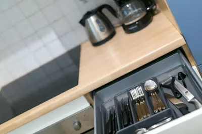 a kitchen counter with a cutting board on top at Apartment Duomo in Bolzano
