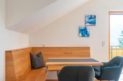a room with a table and two chairs at Sonnenhof Tramin - Adults Only in Termeno