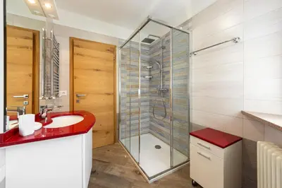 a bunk bed room with two bunk beds at Tobià de Barat in Pozza di Fassa