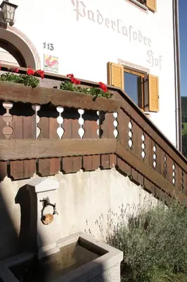 a stairway with a flower box on a building at Paderlafoderhof in Laion
