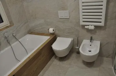 a bathroom with a tub and a toilet and a sink at Chalet Schwarzenstein in Campo Tures