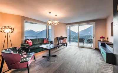 a living room with a couch and a table at Prunner Luxury Suites - Adults Only in Schenna