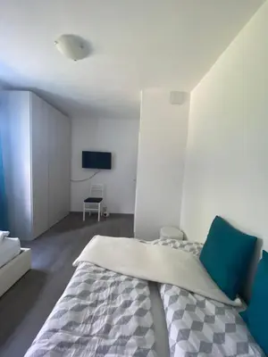 a bedroom with a bed and a tv on a wall at Apartment Peskoller in Falzes