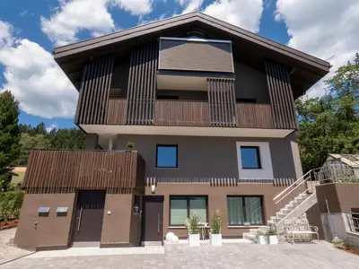 aominium building with a balcony and stairs at Apartment Peskoller in Falzes