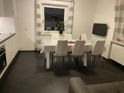 a white dining room with a white table and chairs at Apartment Peskoller in Falzes
