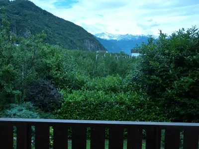 a bench with a view of a mountain at Garni Rebhof in Nalles