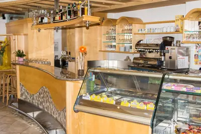a fast food restaurant with a counter with food at Gasthof Paul in Naz-Sciaves
