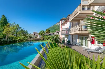 an image of a swimming pool in front of a building at Überbacherhof in Termeno