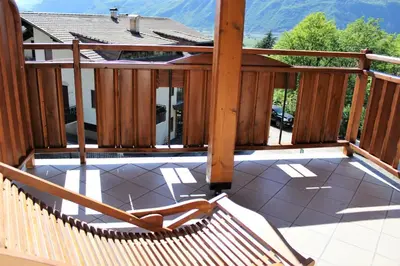 a deck with a hammock on top of a house at Gartenresidence Stephanie by Hotel Rotwand in Laives