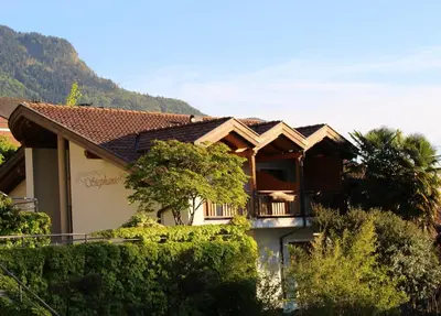 a house with a balcony on the side of it at Gartenresidence Stephanie by Hotel Rotwand in Laives