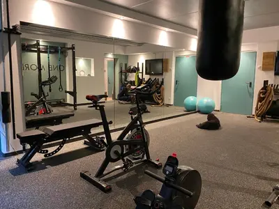 a gym with a punching bag and some exercise equipment at Mi Chalet in La Villa