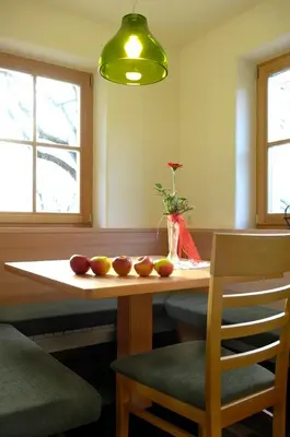 a dining room table with fruit on top of it at Villa Tilia in Siusi